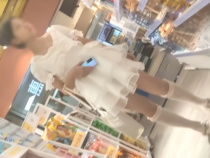 [Voyeur Video] A teen girl dressed entirely in white (including her panties, of course) caught in a reverse-angle upskirt shot—pretty hot stuff