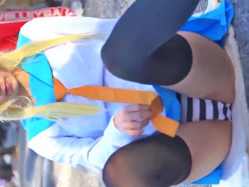[Voyeur Video] Don't miss this! The moment a top-tier cosplayer accidentally spreads her legs, revealing a glimpse of her striped panties